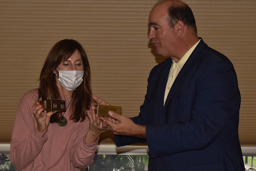 Pippa Schwimmer and Andrew Ford look at a bird box.