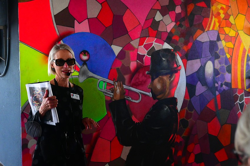 Arts Advocate docent Stephenie Frasher speaks about the Music mural by Chor Boogie on the fourth floor of the Palm Ave. parking garage. (Photo: Spencer Fordin)