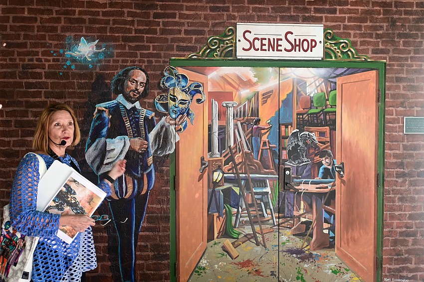 Docent Nannette Crist stands in front of Nate Baranowski's Shakespeare mural at Florida Studio Theatre. (Photo: Spencer Fordin)