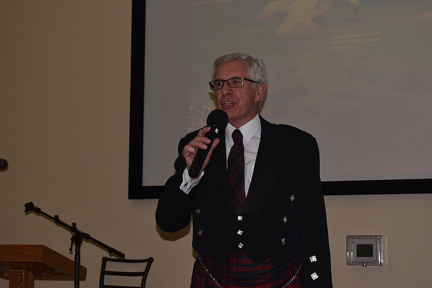 Rev. Norman Pritchard addressed his congregation before dinner.