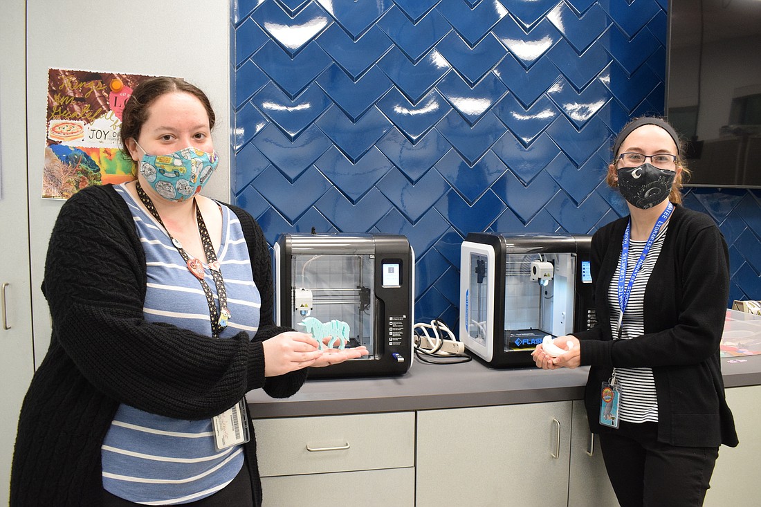 Rachel Scharbo and Amanda Gates, who are library assistants, love working with the 3D printers in Studio 70.