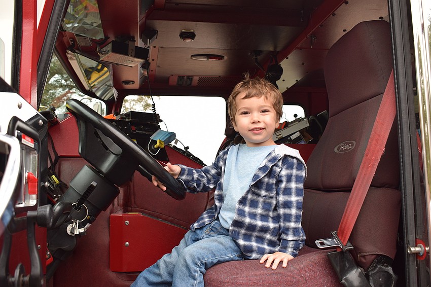 Myakka City 2-year-old Maverick Jones enjoys sitting in an East Manatee Fire Rescue truck.
