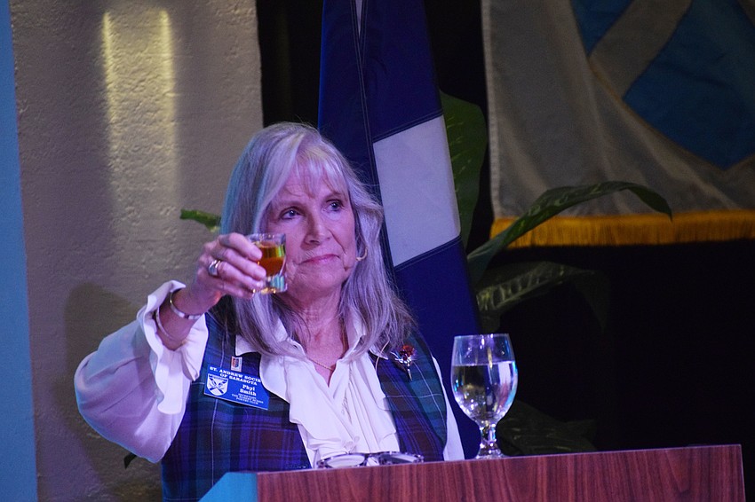 Phyl Smith toasts Robert Burns at the Burns Supper at Palm Aire Country Club.