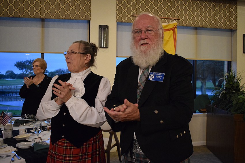 Port Charlotte's Melissa Craig and her husband, Dennis Craig, conduct a slow clap during the seating of friends of the bard.
