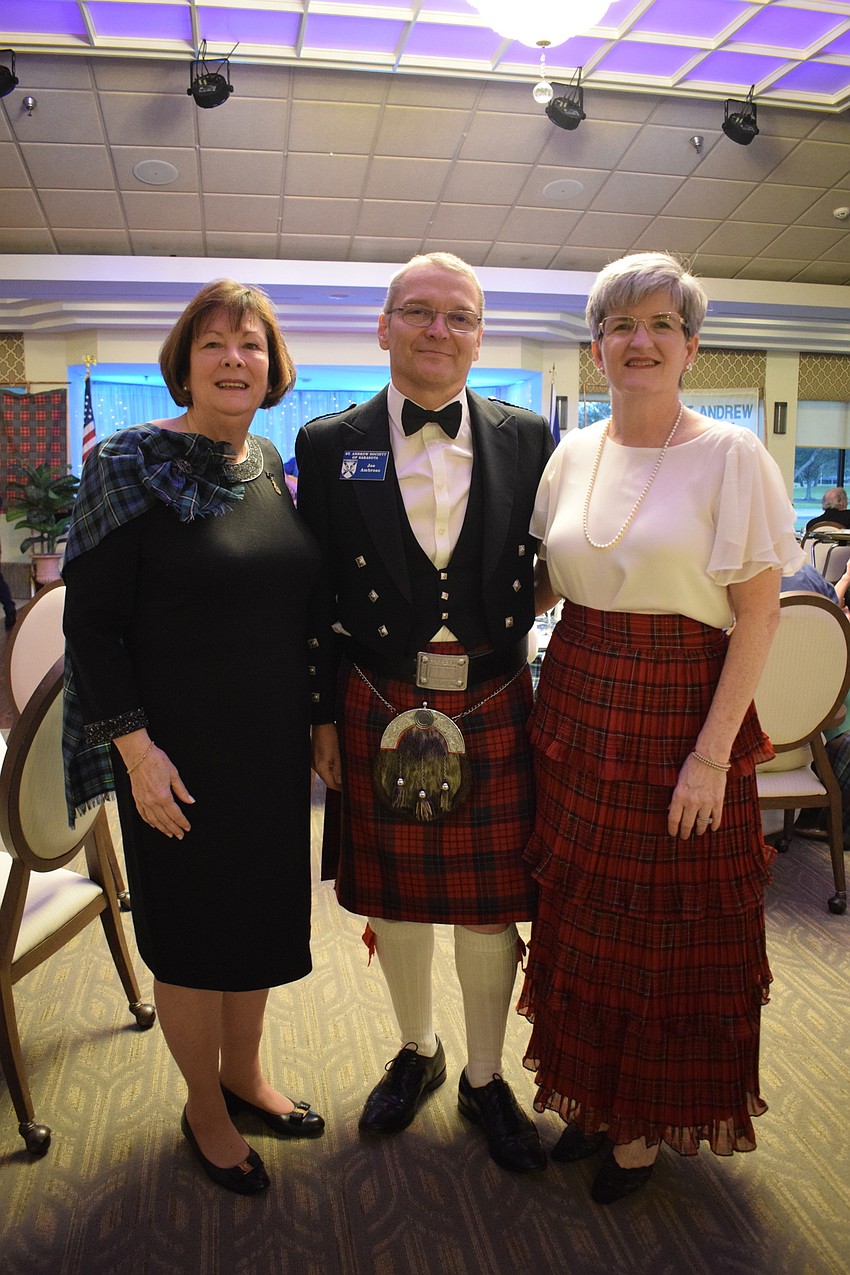 Venice's Carole Cornell and Sarasota's Joseph Ambrose and his wife, Deidre Ambrose, look forward to the toast to the haggis.