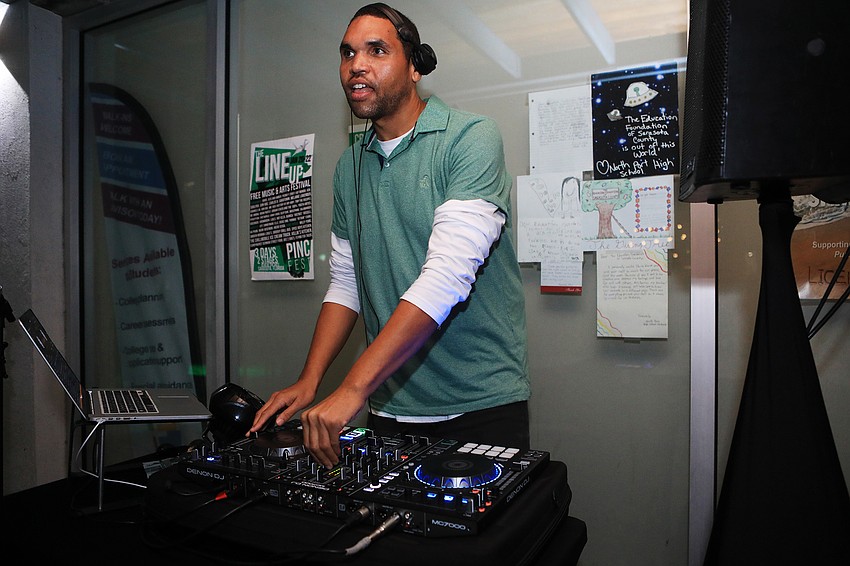 Jawara Gordon plays music for the crowd.