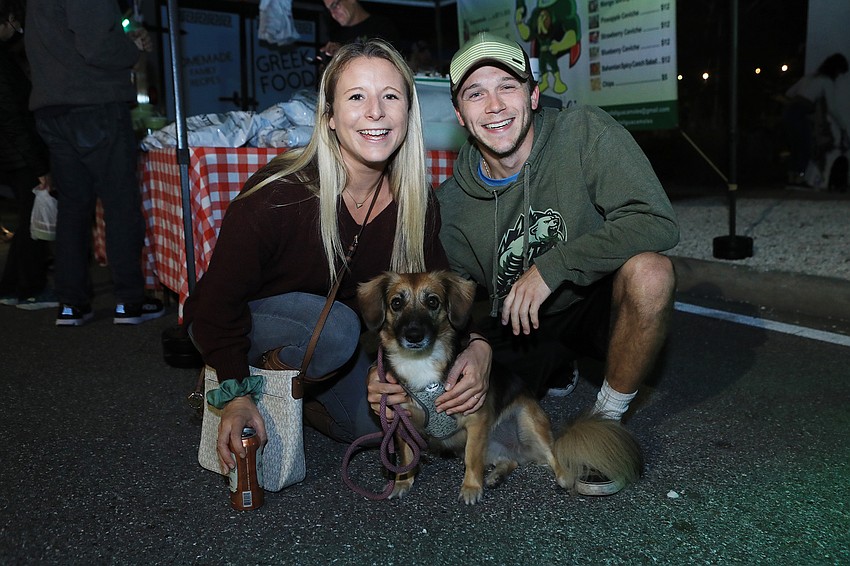 Monica Lee and Dakota Wojcik with Oakley the dog