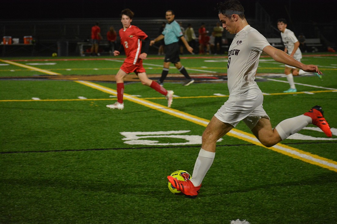 Riverview boys senior Luke Spycher kicks the ball down the field against Cardinal Mooney High. The Rams are the top seed in their district.