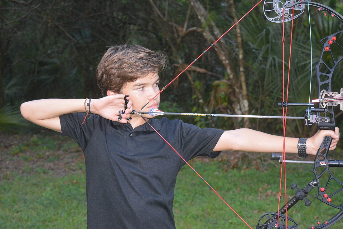 Robbie Hubbell aims his compound bow at a Sarasota Archers meeting. File photo.