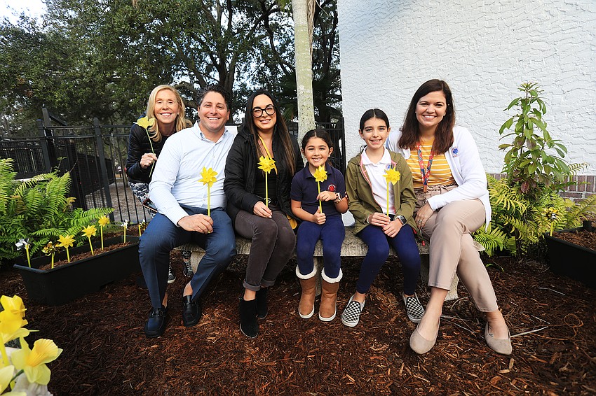 Barbara, Ryan, Sepi, Sienna and Arianna Ackerman with principal Jamie Hannon