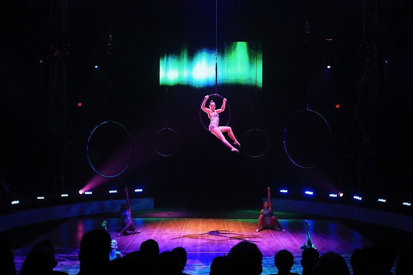 CAC students spin in an aerial lyra act.