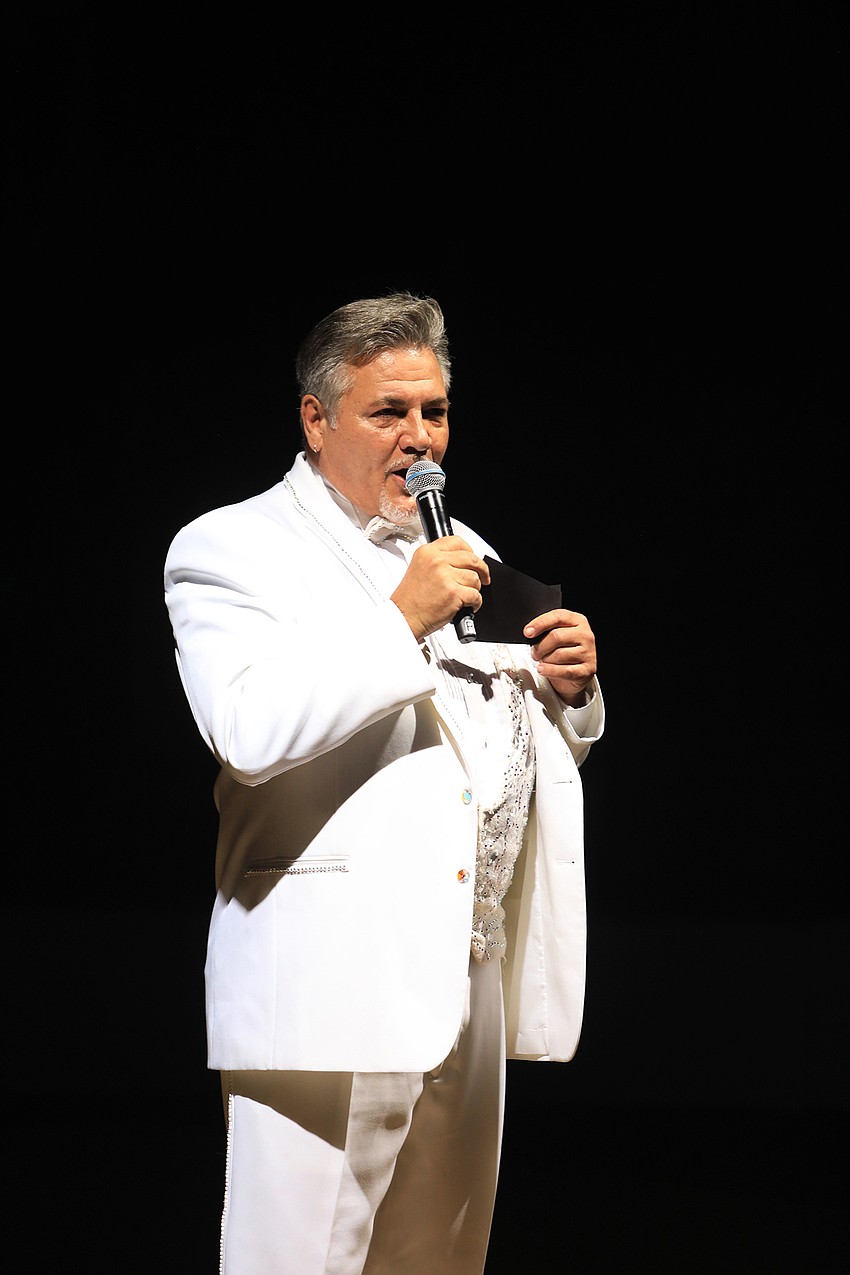 Emcee Jared Walker directs the event.