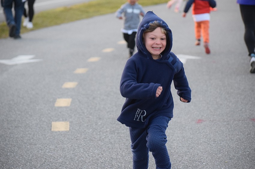 Five-year-old Brendan Parks Robinson, the grandson of former SANCA Board Chair Bill Robinson, sprints to the front during the Big Bill Foundation Kids Dash.
