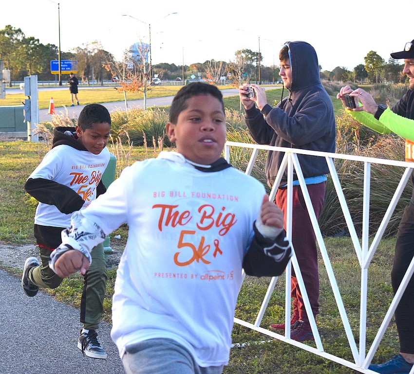 Francisco Flores, 10, won the 12 and under Kids Dash.