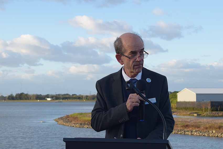 Sarasota County Commissioner Rod Cutsinger spoke during the ceremony at Nathan Benderson Park to dedicate the trail around the lake to the late Bill Robinson.