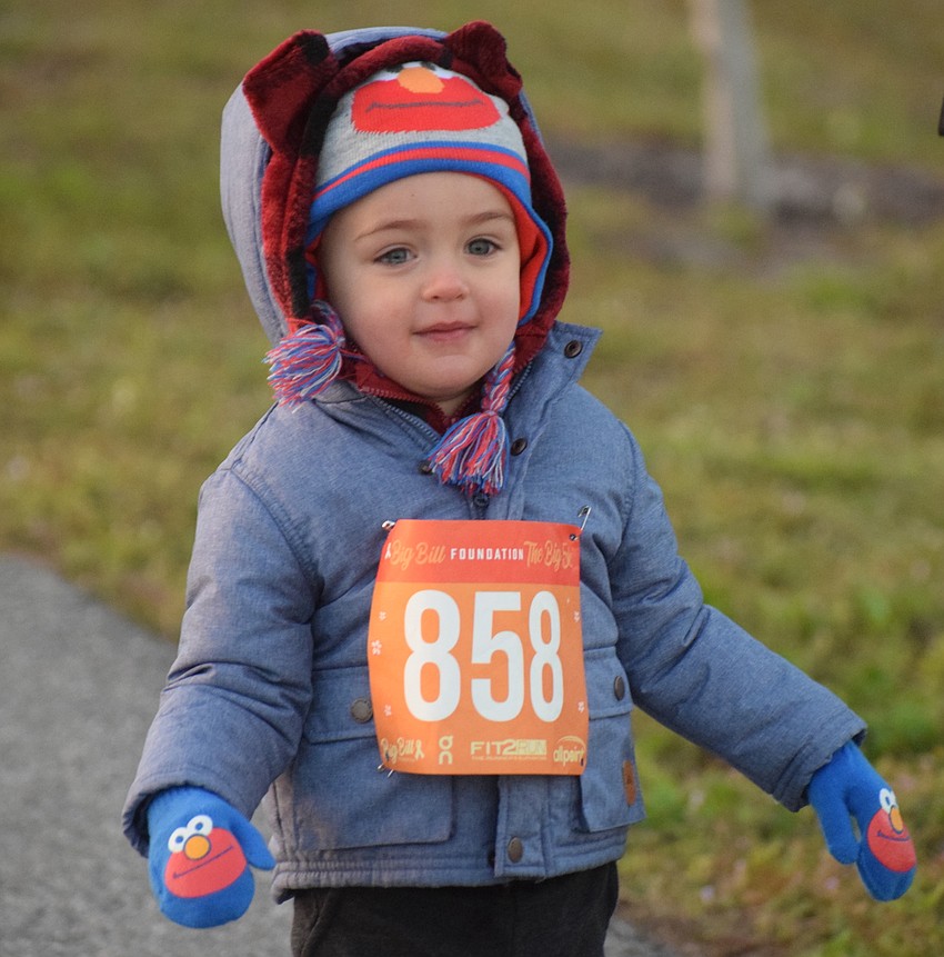 Many of the runners at the Big Bill Foundation 5K and Kids Dashes, such as 2-year-old Charlie Hale of Sarasota, dressed for the frigid temperatures.
