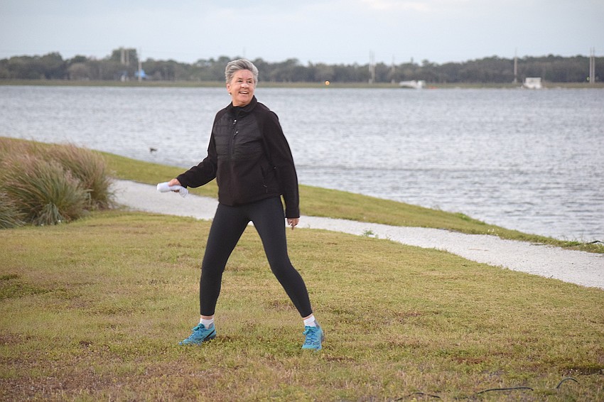 Sheri Bedford of Sarasota was warming up before the Big Bill Foundation 5K at Nathan Benderson Park in Sarasota. Bedford says at the age of 69, she needs some extra warmup, especially when the temperature is in the 40s.