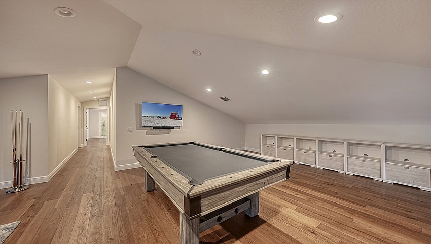 A recreation room is on the second level of the garage.