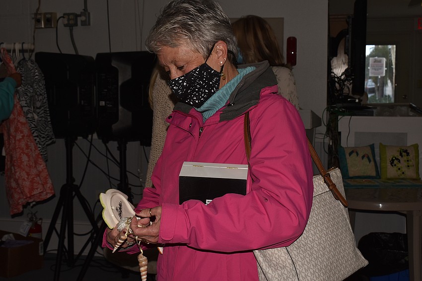 Cate Thomsen looks over her finds.