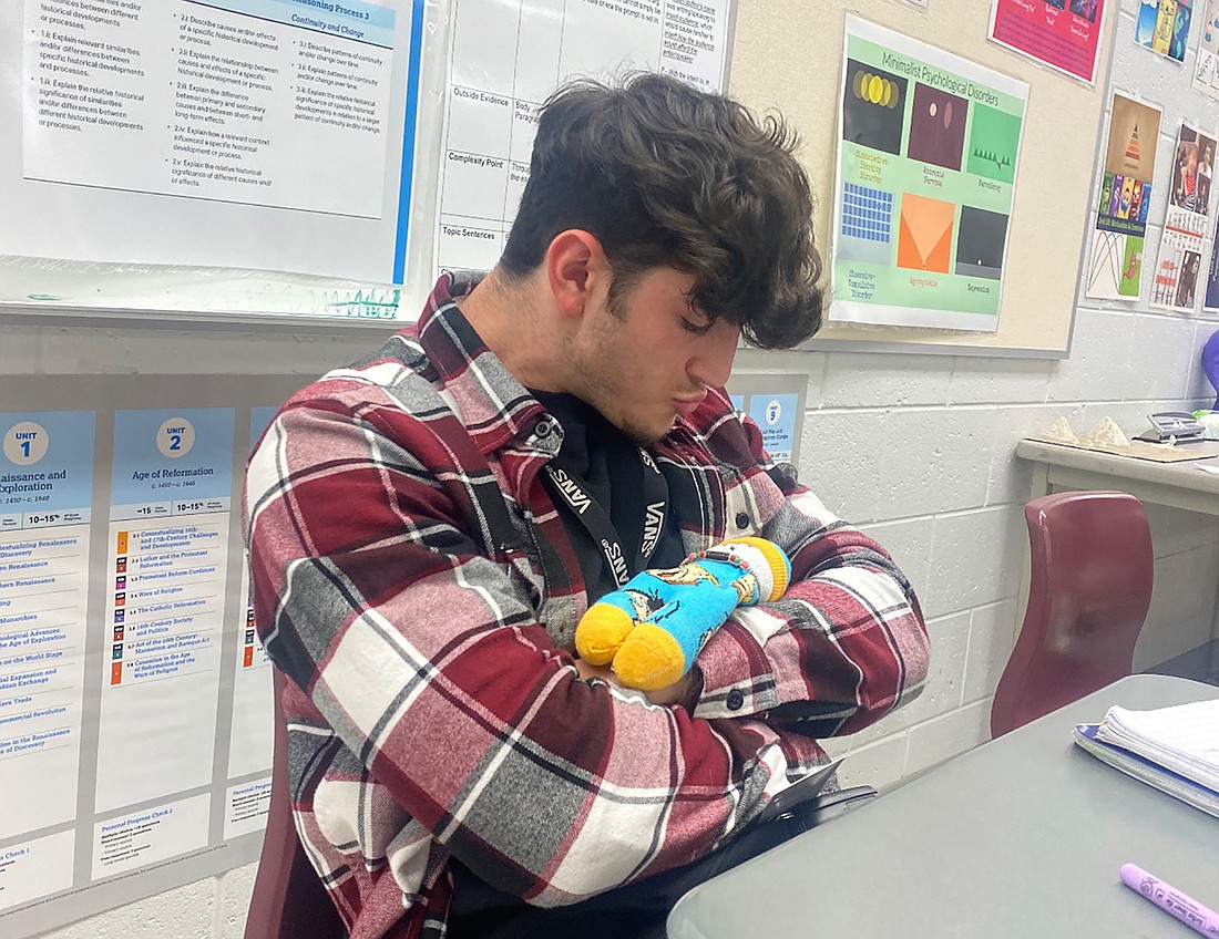 Junior John Sirignano says caring for his sock baby, Oswald, has made him excited to become a real parent in the future. Courtesy photo.