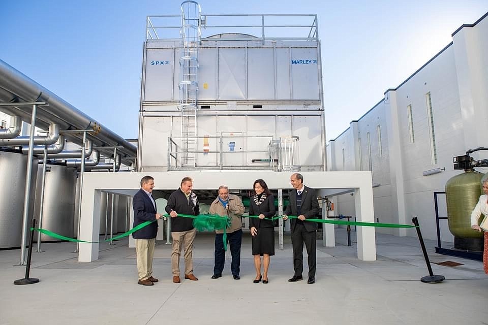 County Commissioner Alan Maio cutting the ribbon in front of the new downtown cooling plant. (Photo courtesy of Sarasota County)