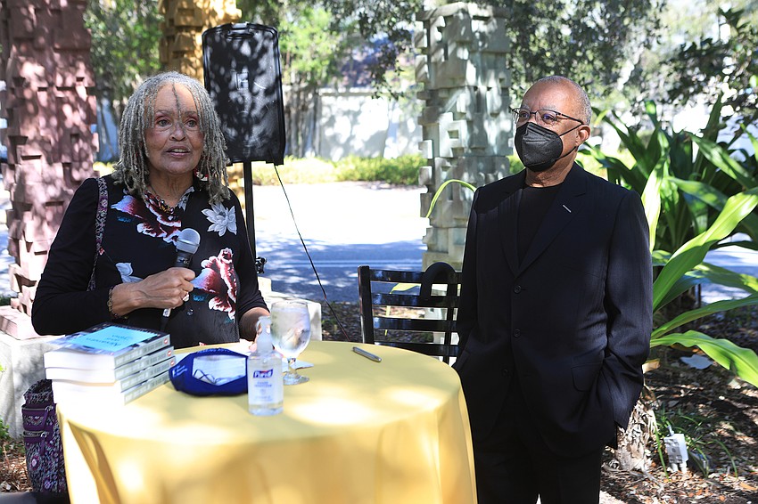 Charlayne Hunter Gault and Dr. Henry Louis Gates Jr.  sign books for an eager audience.