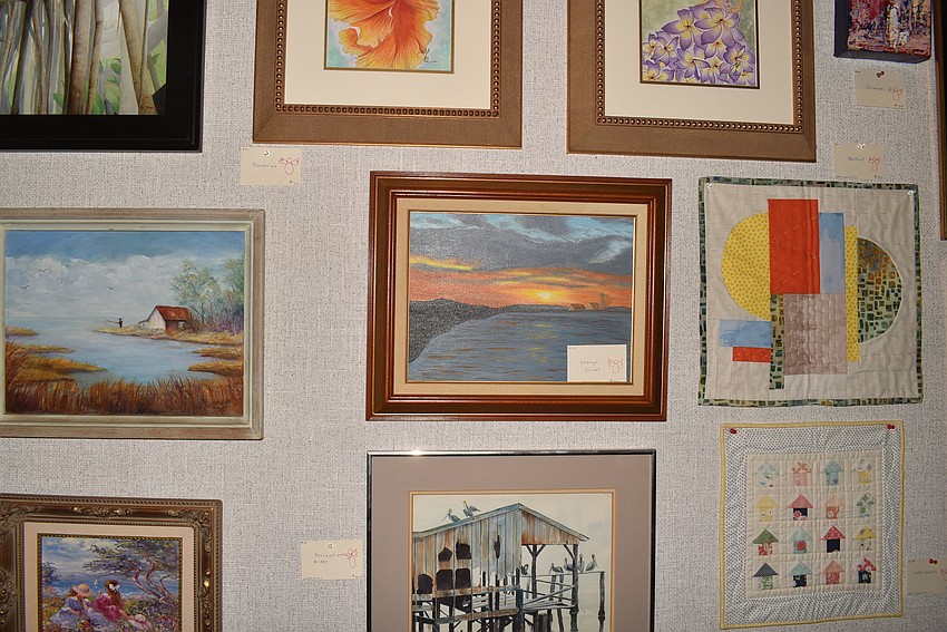 Paintings were organized painstakingly by Linn Torres.