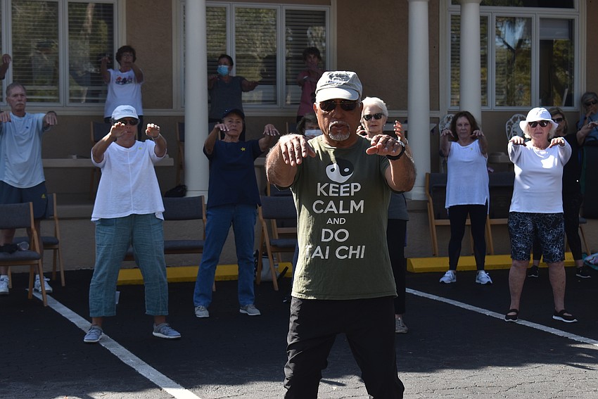 Reuben Fernandez leads the class in tai chi.
