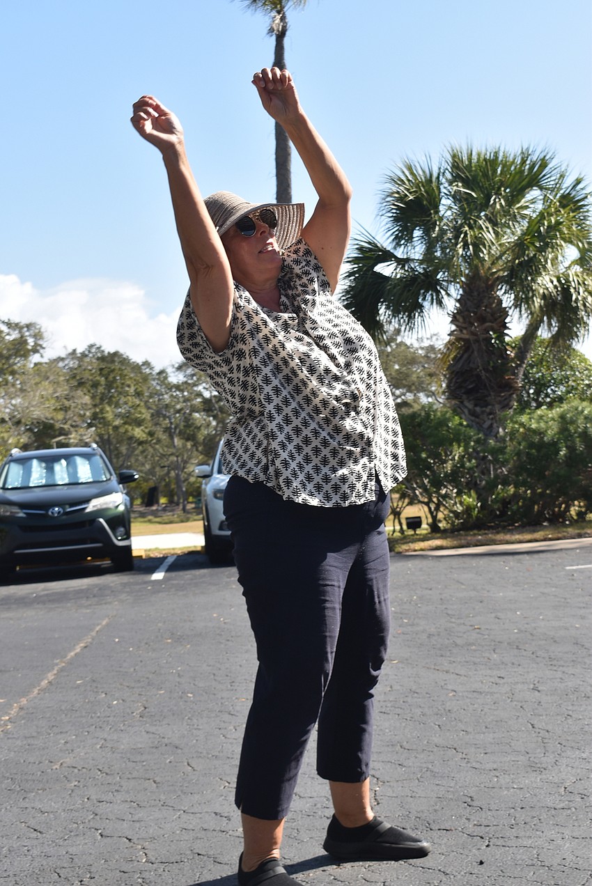 Sandi Love leads in the healing art of qi gong.