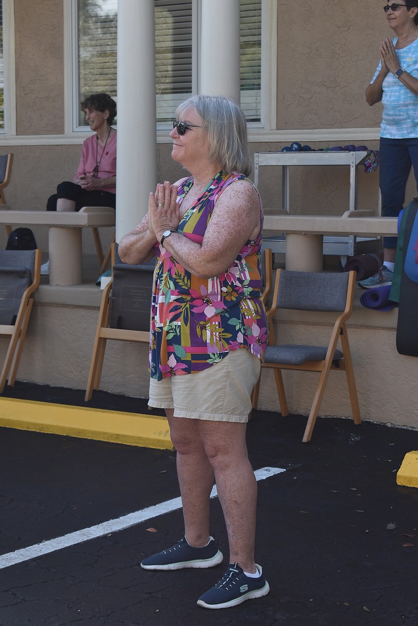 Carol Erker meditates at the end of qi gong.
