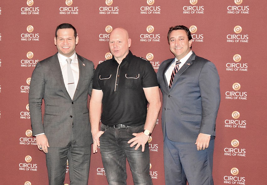 Mayor Erik Arroyo of Sarasota and City Commission Hagen Brody pose for a photo with Ring of Fame inductee Nik Wallenda,