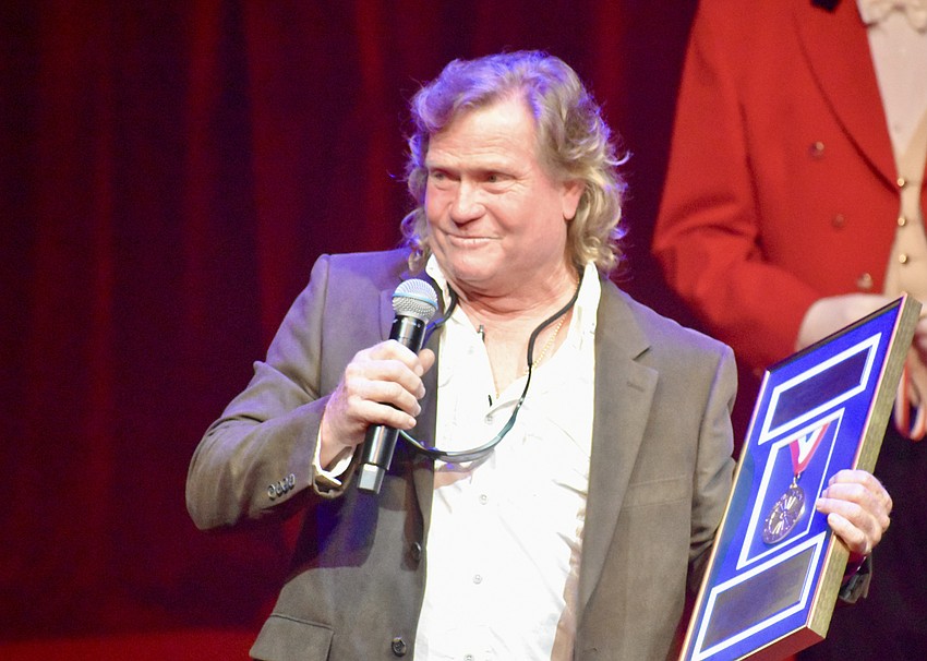 Tom Edelston accepts the plaque for his father, the late Willie Edelston.