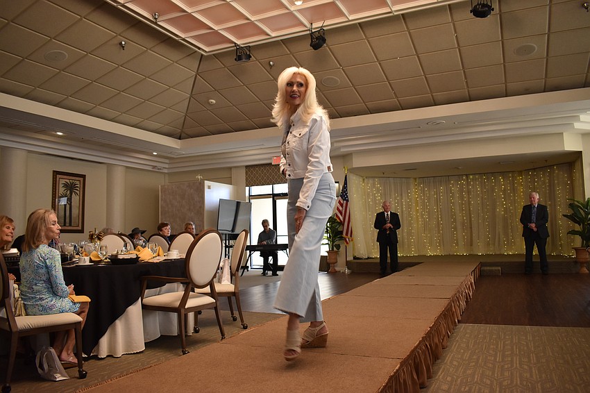 Melodie Dickerson, the music program manager at State College of Florida, shows off an outfit supplied by Dillard's.