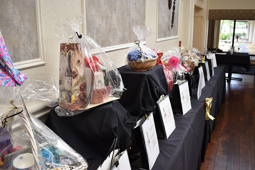 Some of the raffle prizes await pickup by guests after the fashion show.