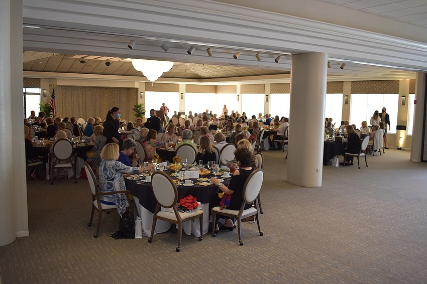 Those who attended the Mission Possible fashion show pack the Palm Air Country Club.