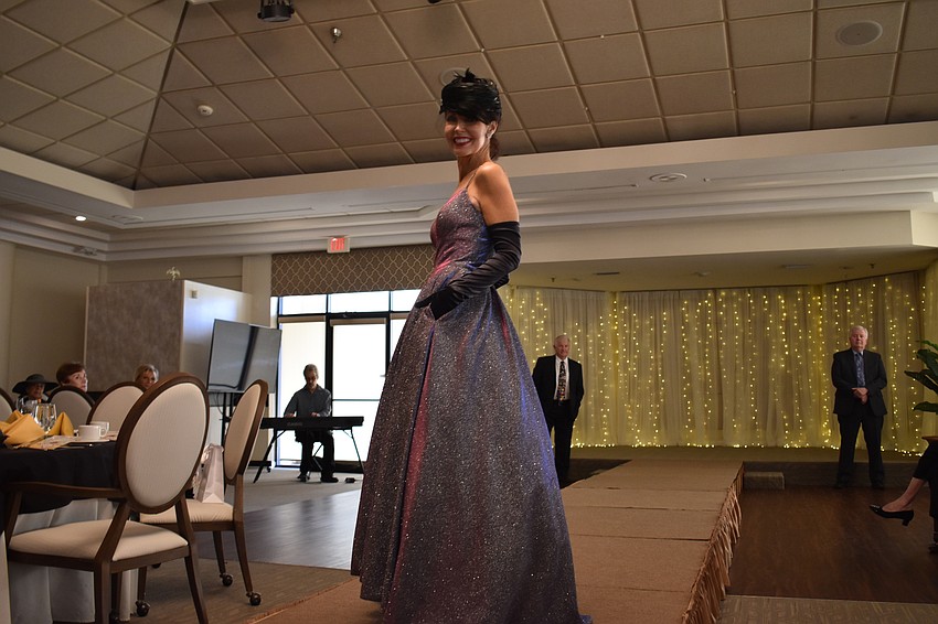 Katherine Pike, a fashion show committee member, is the picture of elegance on the runway.