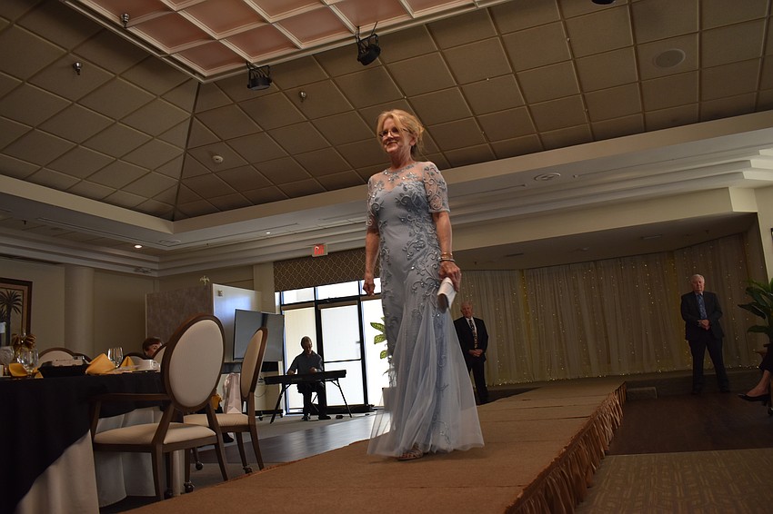 Jane Herrin, the Longboat Key fire marshal, appears ready for a formal occasion as she walks the runway.