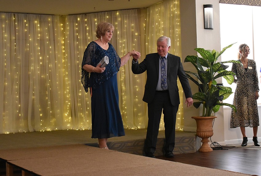 Debi Frock of the Palm Aire Women's Club, completes a turn on the runway.