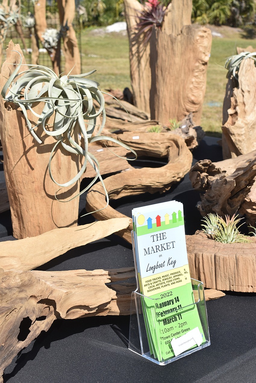 Flyers for next month's market sat amongst pieces of driftwood for sale.