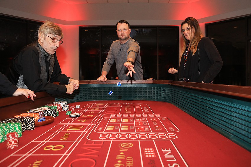 Ryan and Melissa Rand throw some dice.