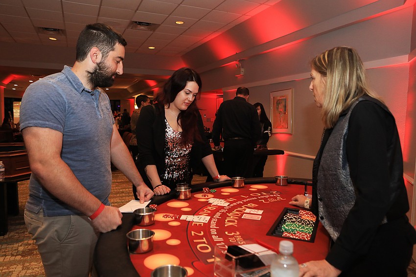 Brandon Gundrum and Ciarra Layton play the cards.