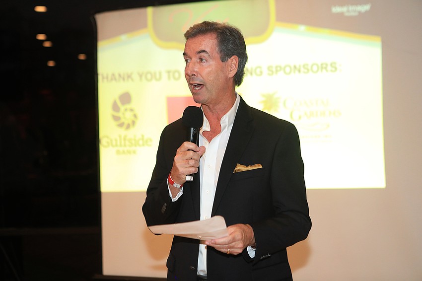 Master of ceremonies Ray Collins speaks to the audience.