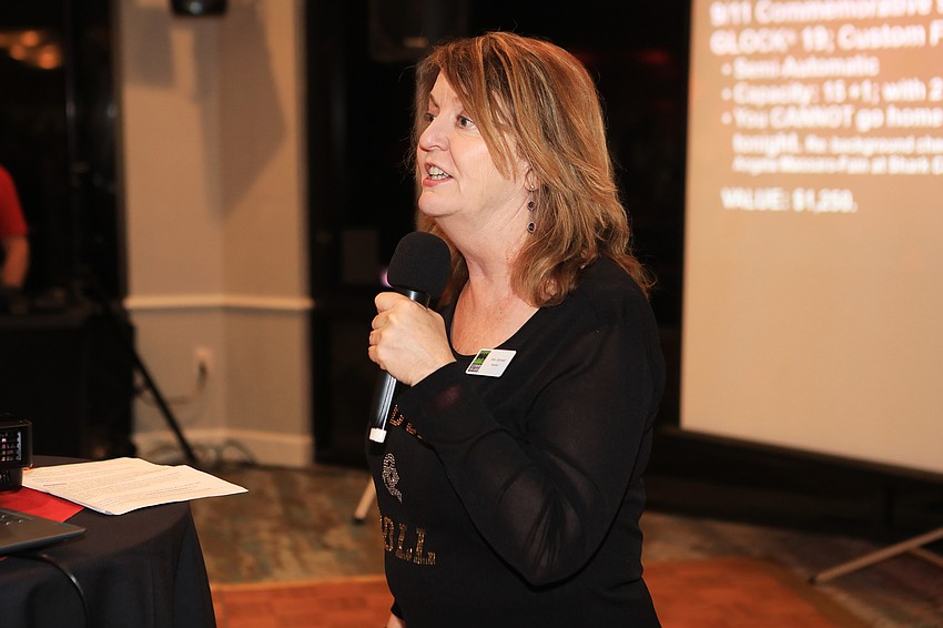 Board Chair Amy Gorman announces a number of awards for members.