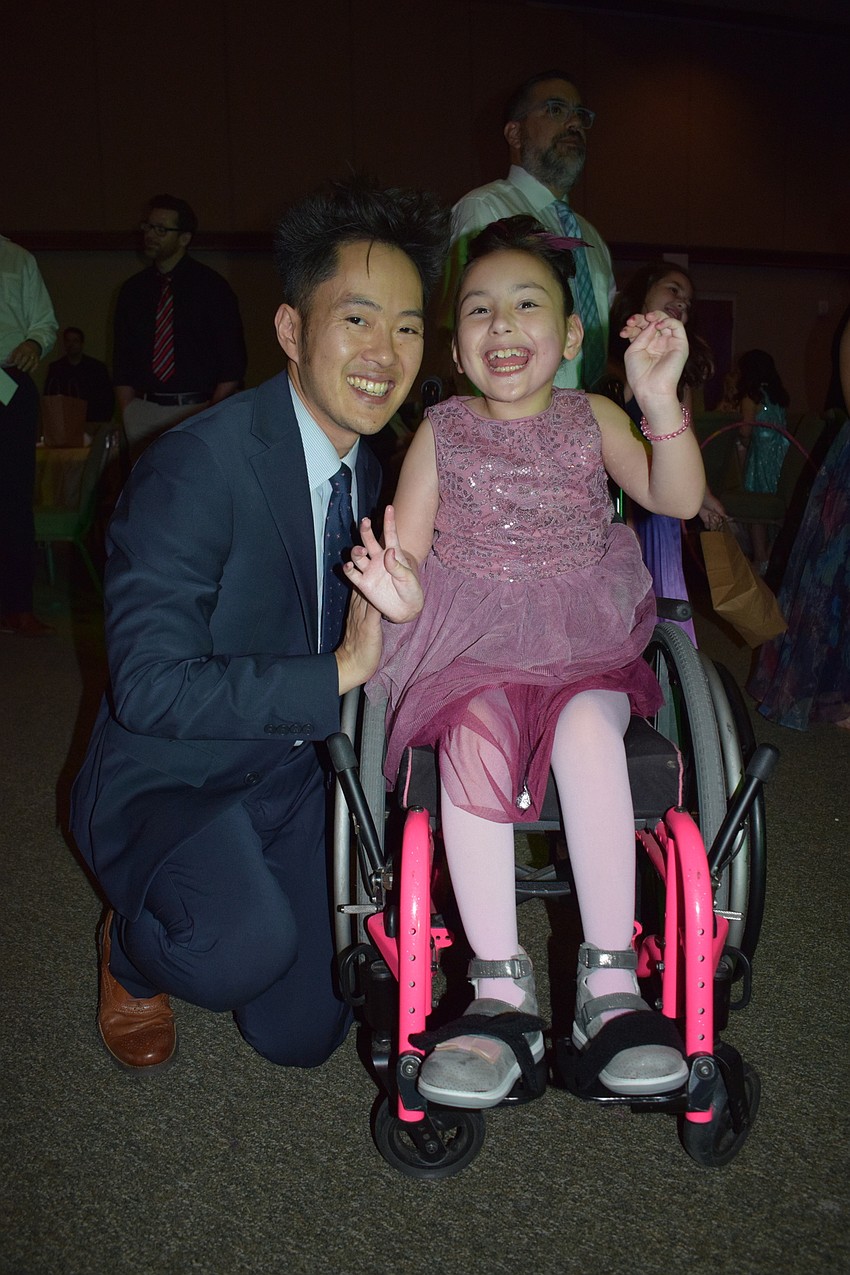 Leo Kao dances with his second grader Sophie Kao. Leo Kao says he loved taking photos and dancing with his daughter.