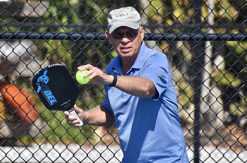 Art Davis prepares to serve.