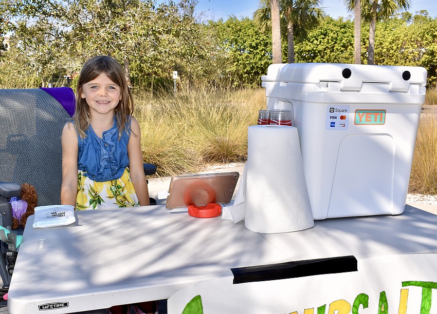 Penelope Hagen, 7, sells lemonade.
