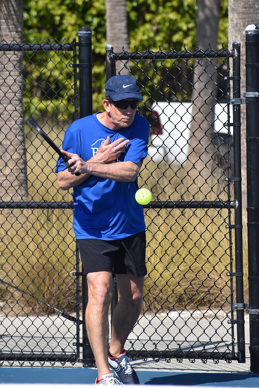 Jonathan Burgiel serves during a match.