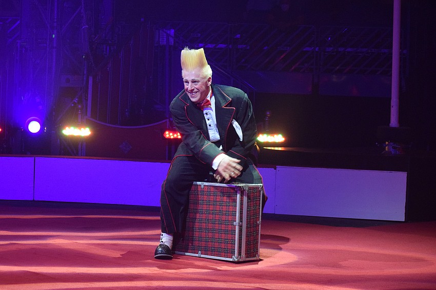 Bello Nock provides some comedy to the show by trying to move his suitcase that won't budge.