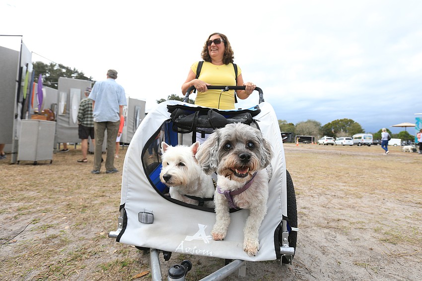 Patricia Holden strolls with her dogs Kenzie and Bailey.