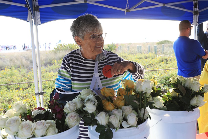 Janet Smith helps arriving couples.